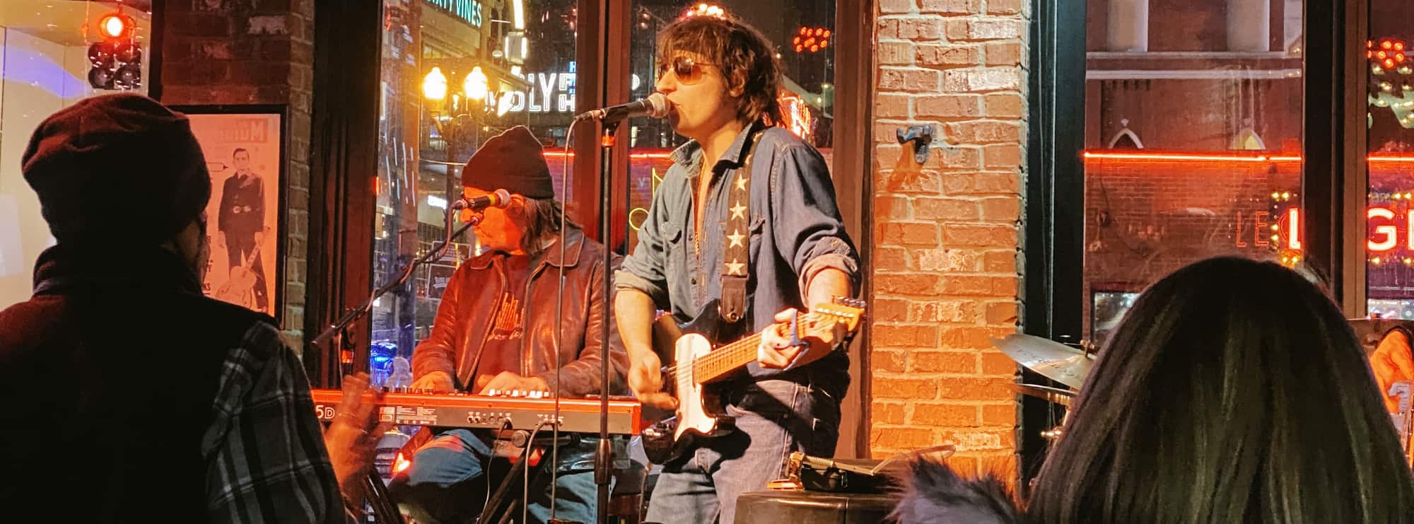 bar singer on guitar in Lexington