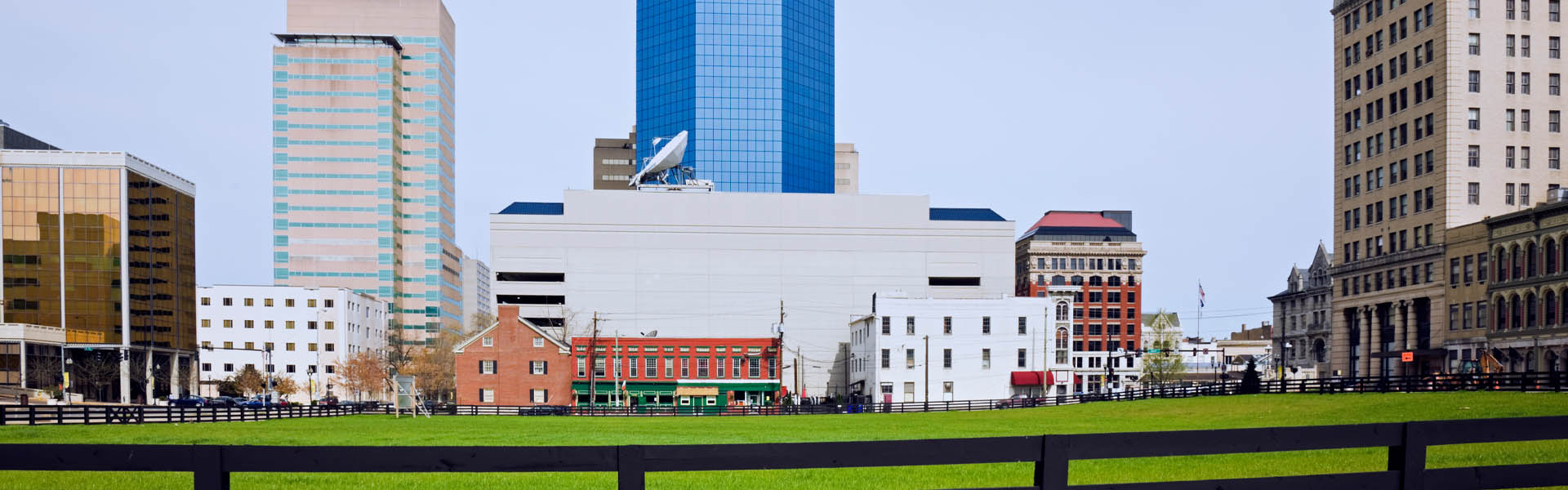 Neon color image of a band playing and people singing along